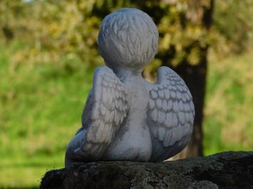Kleiner sitzender Engel – Steinfigur