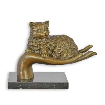 bronzen beeld van een poes , hand